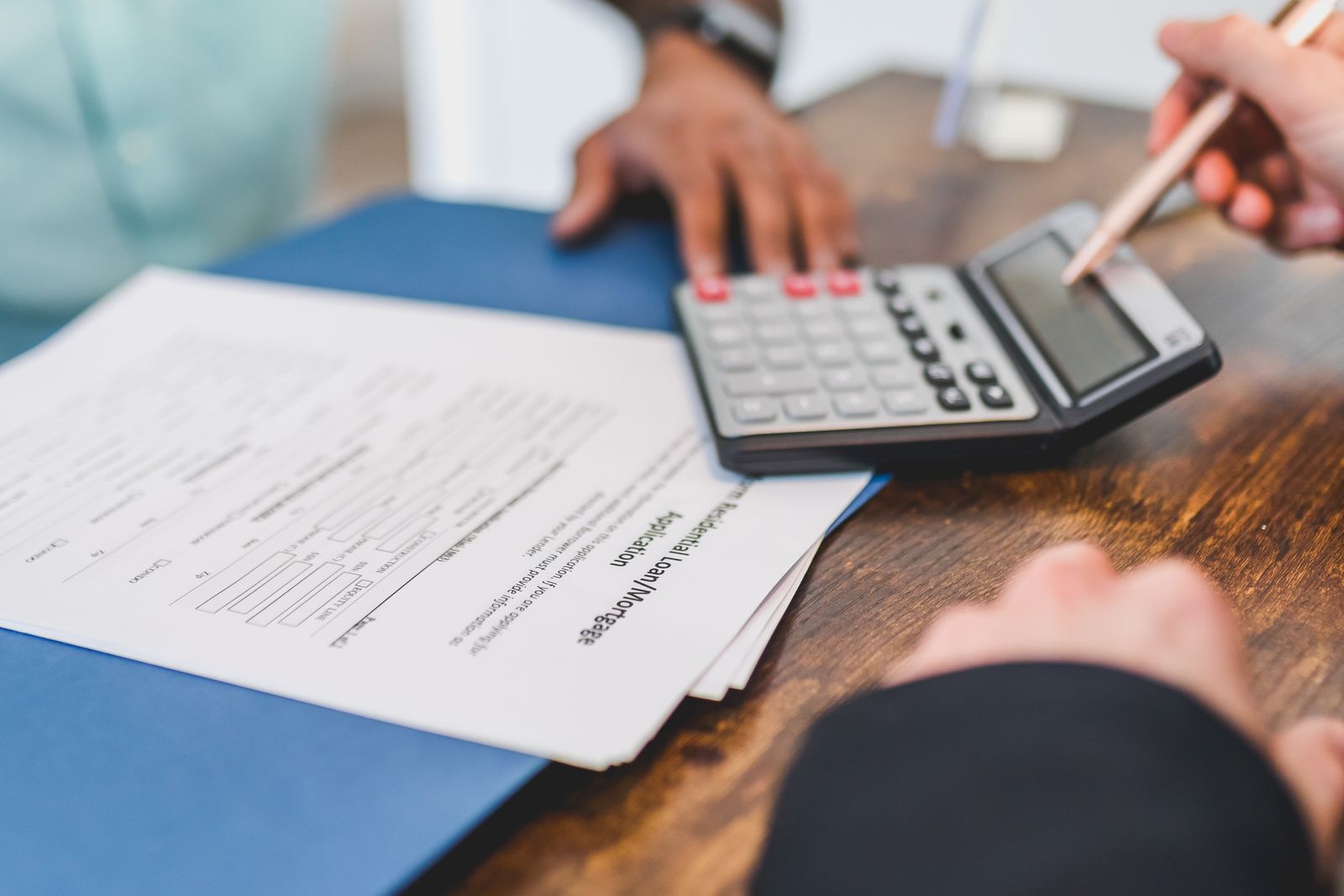 Finance broker reviewing loan options with a client