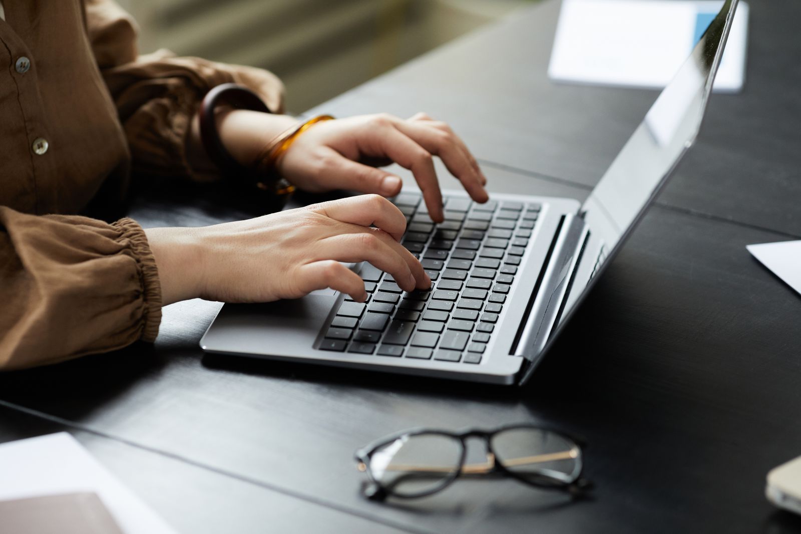Person comparing car loan options on a laptop
